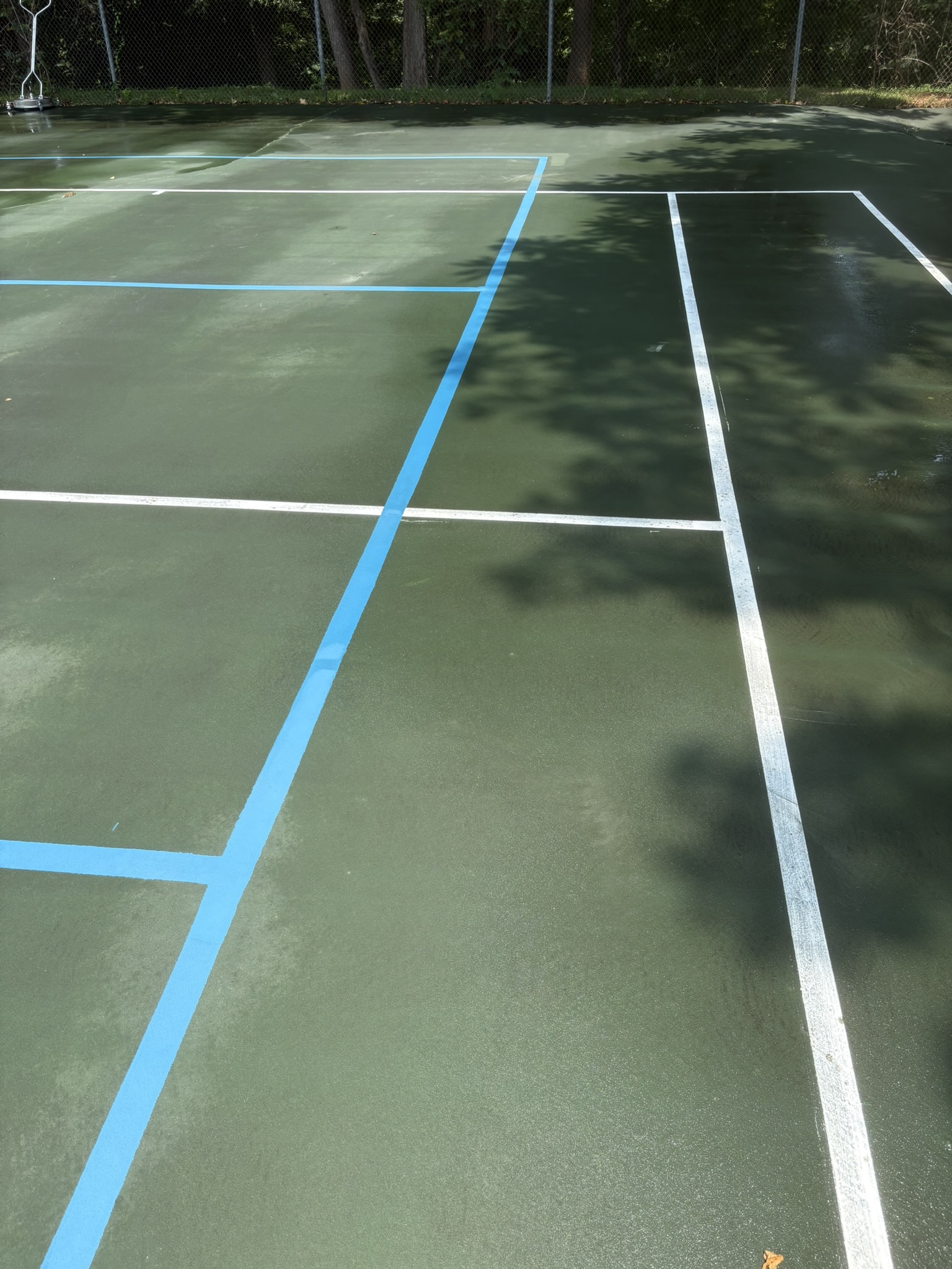 Removing Years of Dirt from a Tennis Court in Lynchburg, VA