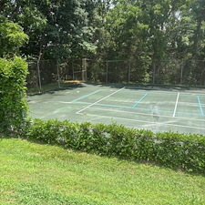 Removing-Years-of-Dirt-from-a-Tennis-Court-in-Lynchburg-VA 1